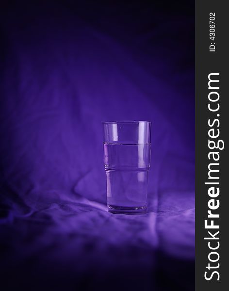 Glass of Water with blue background. Glass of Water with blue background