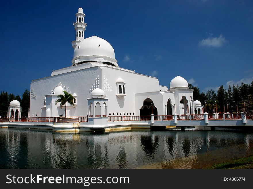 Flouting mosque on the blue sky background