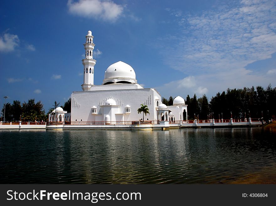 Flouting mosque on the blue sky background