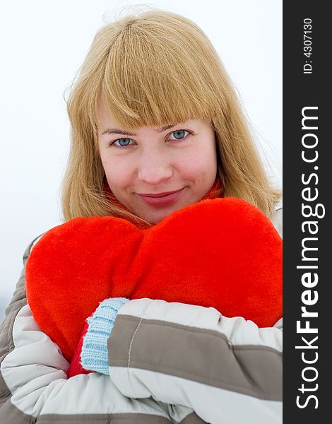 Young girl outdoor with red heart. Young girl outdoor with red heart