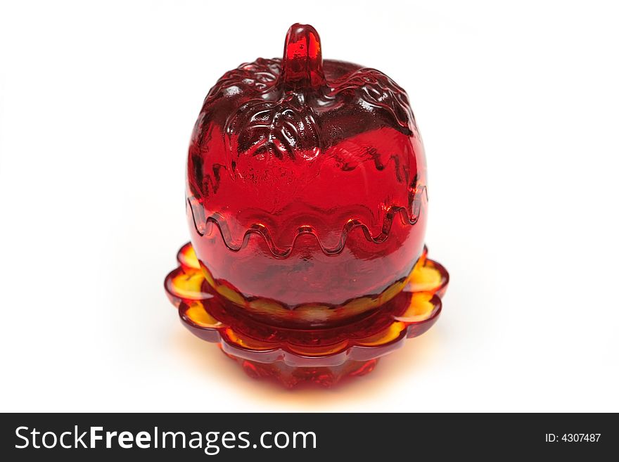 Red glass souvenir on the white background