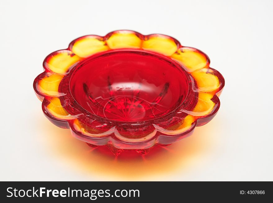 Red glass souvenir on the white background