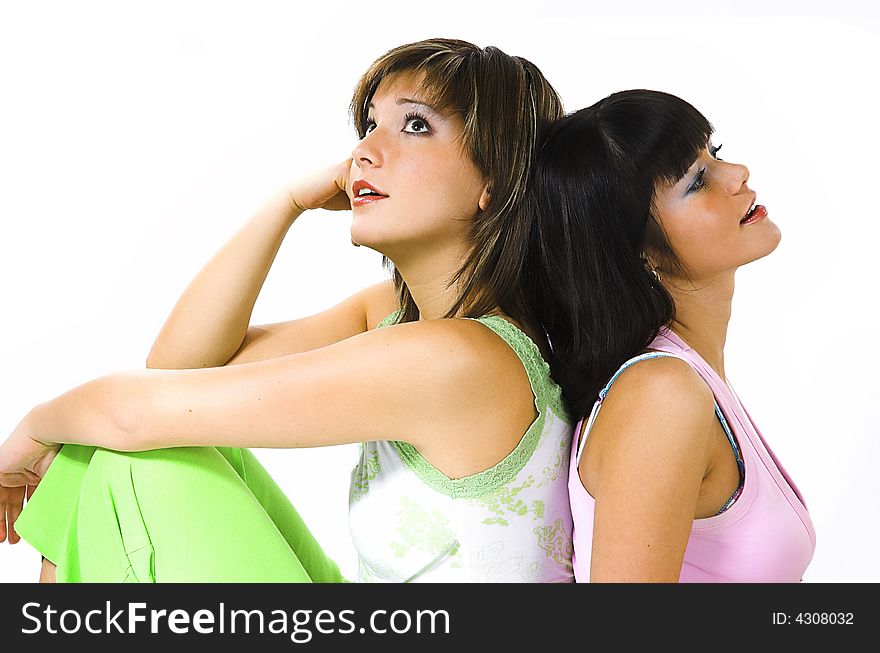 Two girls close up on a white background