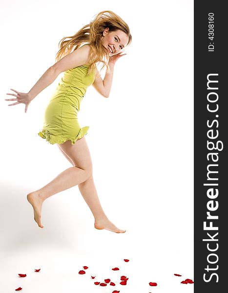 The cheerful blonde jumps on a white background