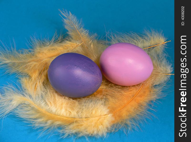 Easter egg with yellow feathers, hand-painted. Easter egg with yellow feathers, hand-painted