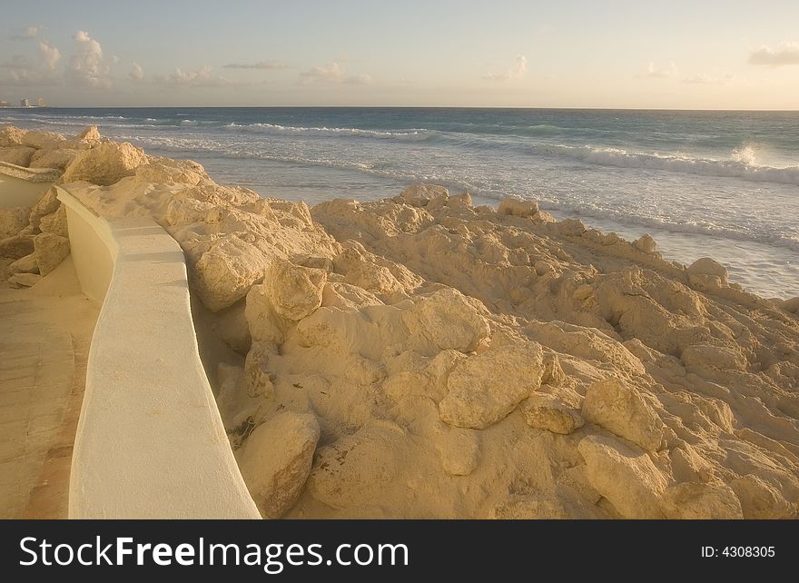 A beach showing erosion and storm damage at dawn. A beach showing erosion and storm damage at dawn