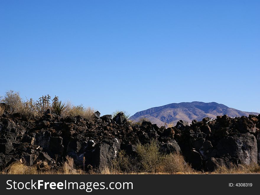 Lava Rocks With Mountain