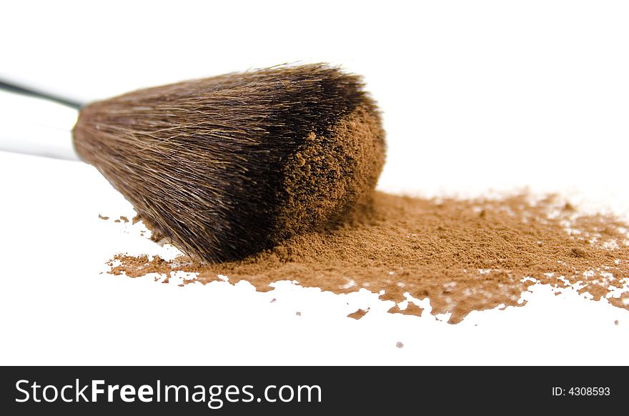 Brush and powder isolated over white