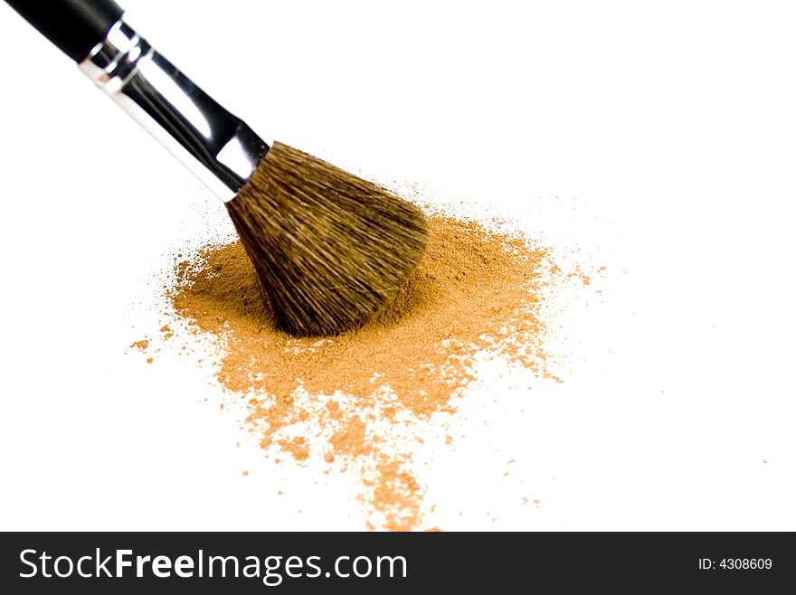 Brush and powder isolated over white