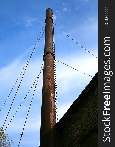 Factory pipe on a background of the dark blue sky