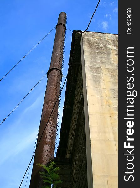 Factory pipe on a background of the dark blue sky