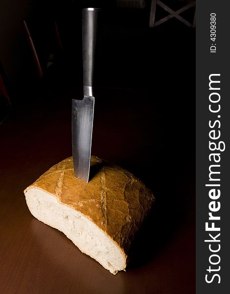 Bread and knife on the table