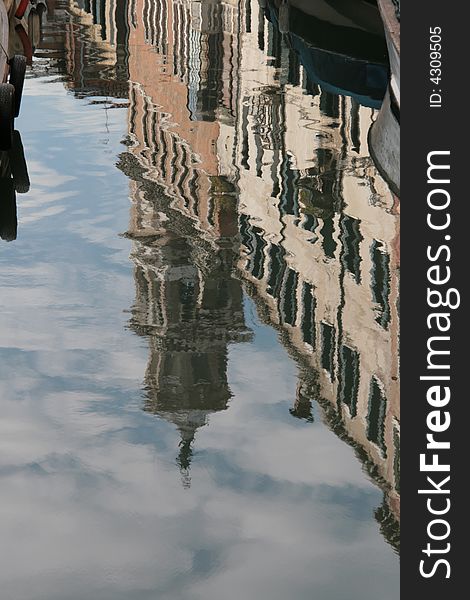 A reflection on a canal of Venice - Italy. A reflection on a canal of Venice - Italy