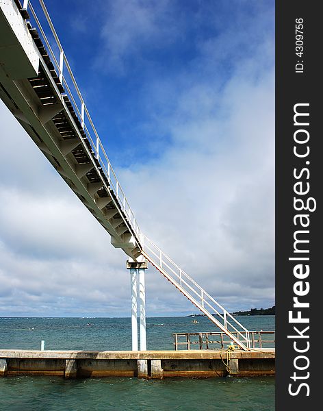 The narrow foot bridge over a channel on Roatan island, Honduras. The narrow foot bridge over a channel on Roatan island, Honduras.