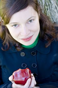 Young Woman And Bitten Apple Stock Photos