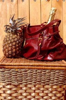 Pineapple A Champagne And A Bag Stock Photography Pineapple A Champagne And A Bag Stock Photography