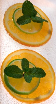 Lime And Orange Segments Whith Mint Royalty Free Stock Images Lime And Orange Segments Whith Mint Royalty Free Stock Images