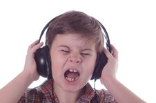 The Little Boy Listens To Music Stock Image The Little Boy Listens To Music Stock Image