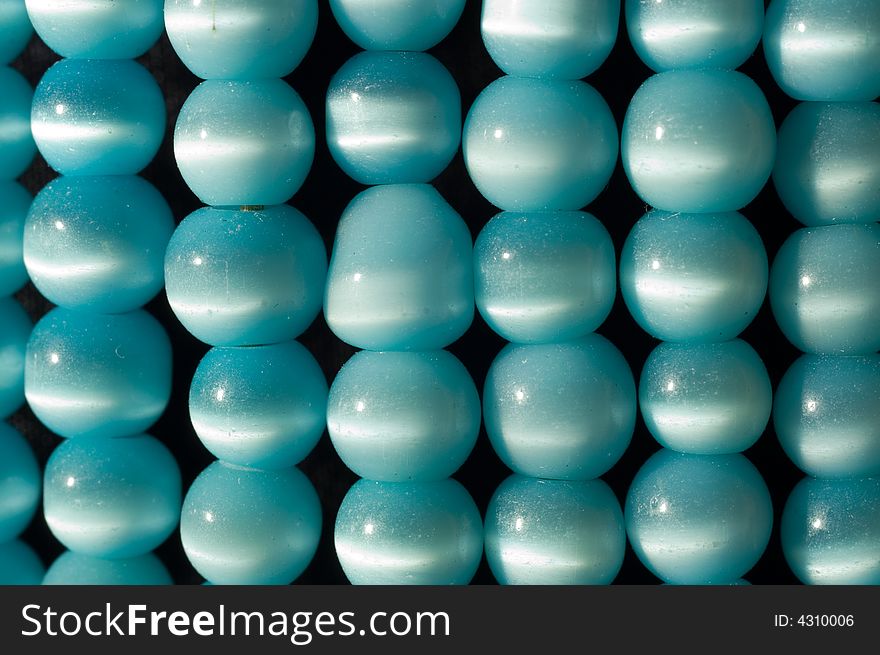 Straight rows of blue beads