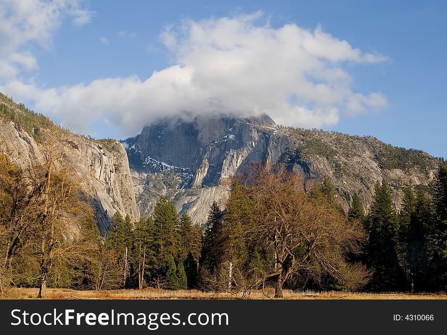 Half Dome covered in fog in Yosemite