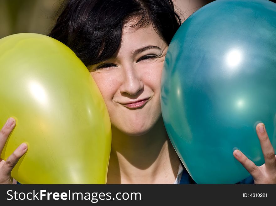 Cute girl between two colored balloons. Cute girl between two colored balloons