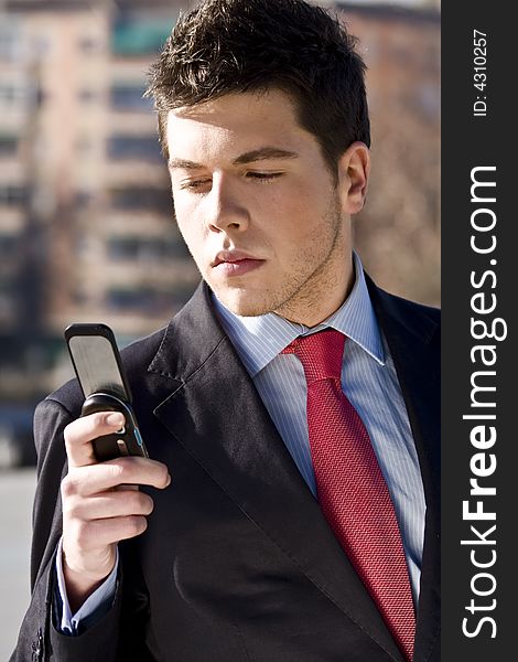 Businessman looking information at his phone. Businessman looking information at his phone