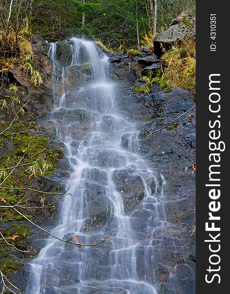 Waterfall In The Mountains