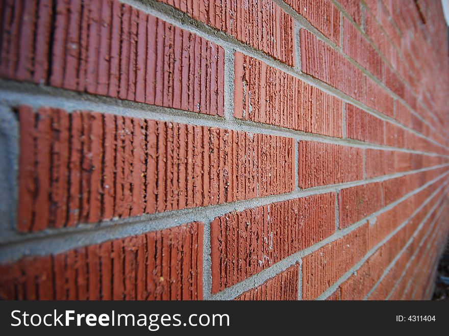 Narrow depth of field of red brick wall. Narrow depth of field of red brick wall.