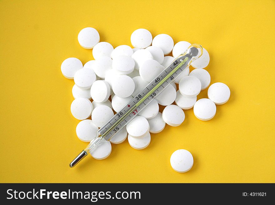 Pills isolated with medicine thermometer . Pills isolated with medicine thermometer .