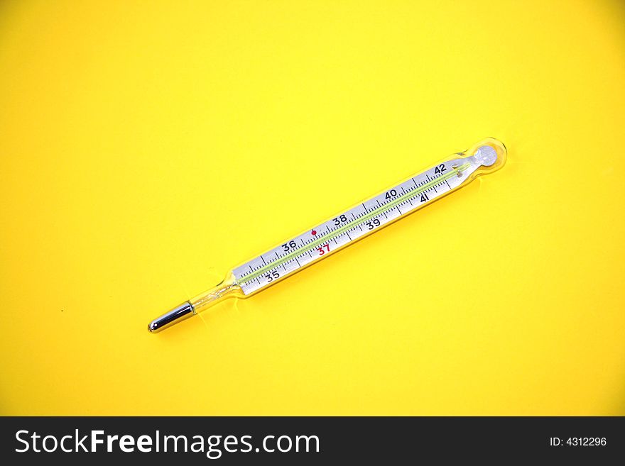 Medicine thermometer  isolated on the yellow background. Medicine thermometer  isolated on the yellow background.