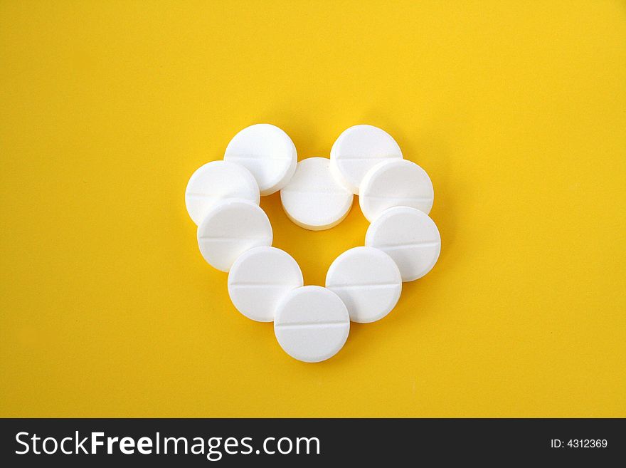 Pills isolated on yellow background. Pills isolated on yellow background.