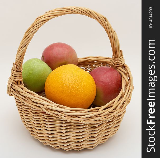 Fresh fruit in basket, isolated