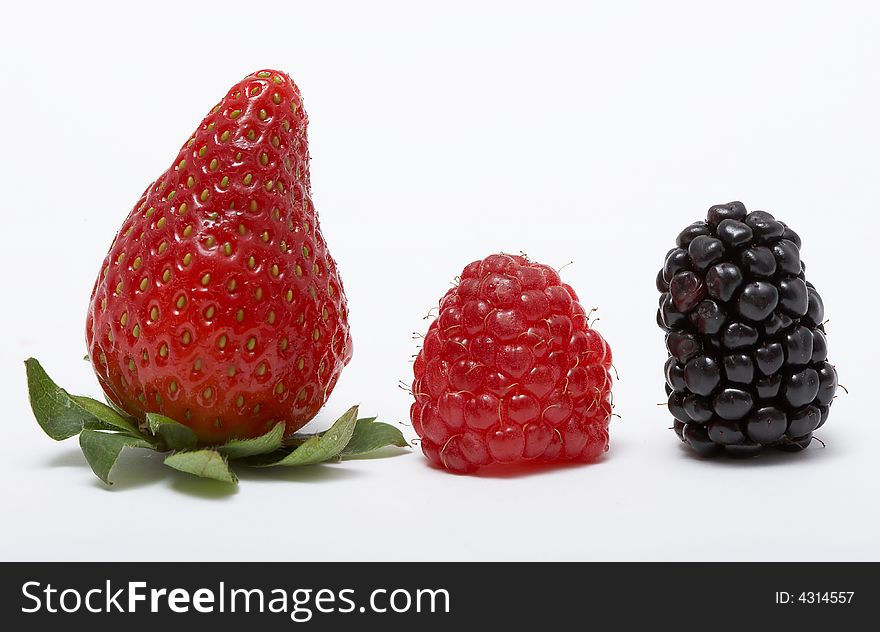 Strawberry, raspberry, and blackberry on white background. Strawberry, raspberry, and blackberry on white background