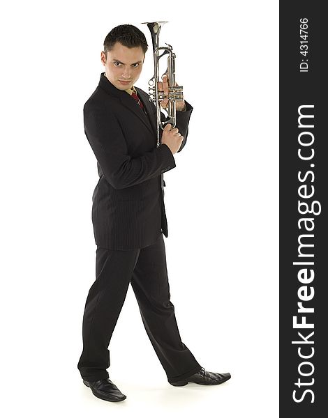 Man in suit holding a trumpet and posing. He's looking at camera. Whole body. Isolated on white background. Man in suit holding a trumpet and posing. He's looking at camera. Whole body. Isolated on white background.