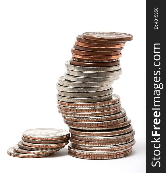 Stack of dollars and coins isolated on white