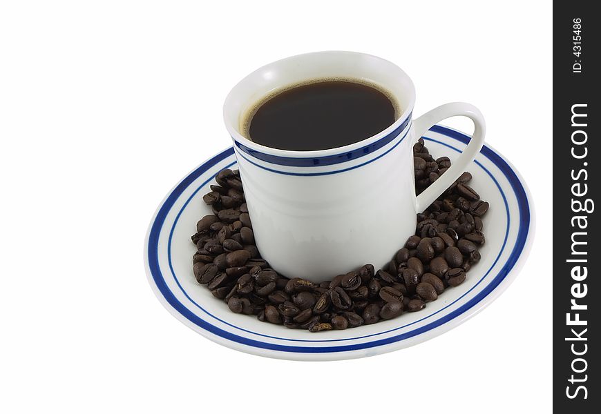 Cup of coffee on a plate with coffee beans, isolated on white