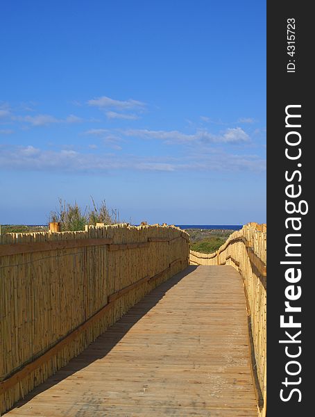 A quiet pathway leads to a beautiful beach. Sardinia beach.