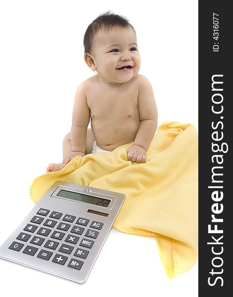 9-month delightful baby with a big pocket calculator  over a white background. 9-month delightful baby with a big pocket calculator  over a white background