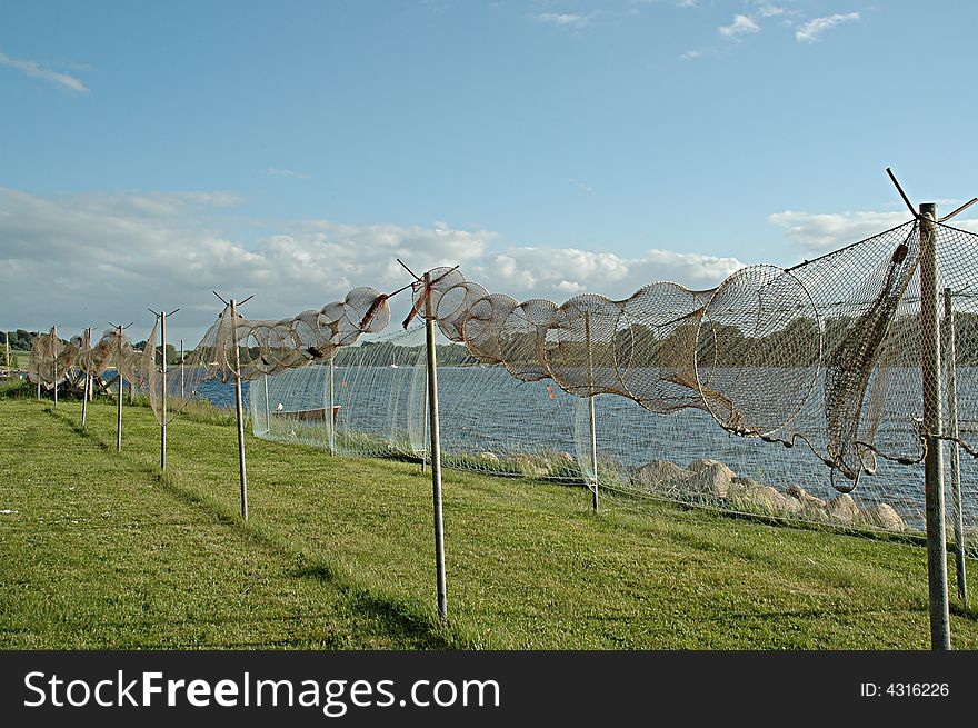 Fishing nets are on land ready for repair.