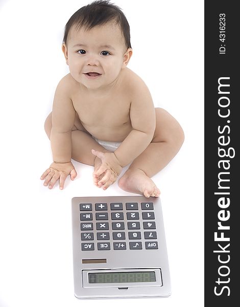 9-month delightful baby with a big pocket calculator  over a white background. 9-month delightful baby with a big pocket calculator  over a white background