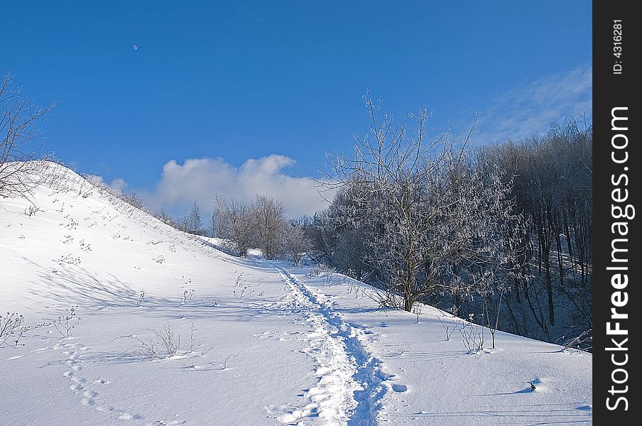 Winter, February. Sunny and frosty day. It seems this road conducts to the clouds :)