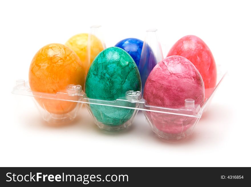 Pack of colorful eggs. White background. Pack of colorful eggs. White background.