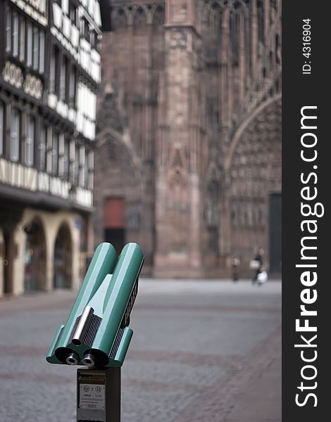 Tourist binoculars to look at the giant cathedral in Strasbourg. Tourist binoculars to look at the giant cathedral in Strasbourg