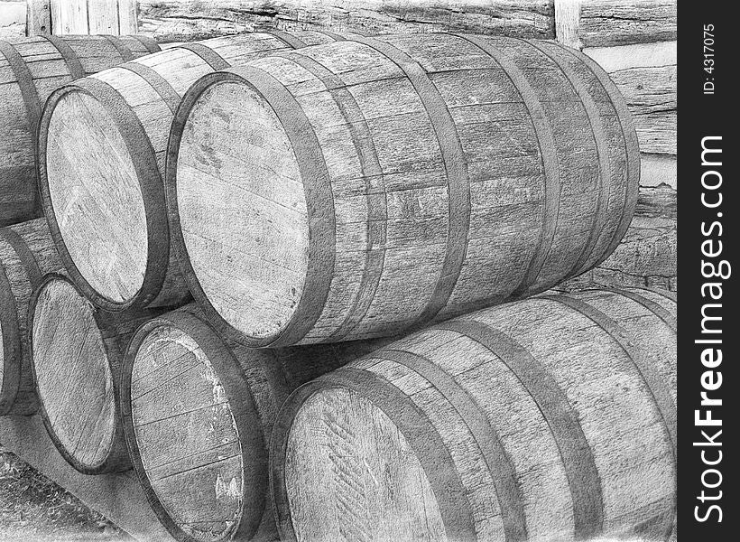 Barrels by cabin wall