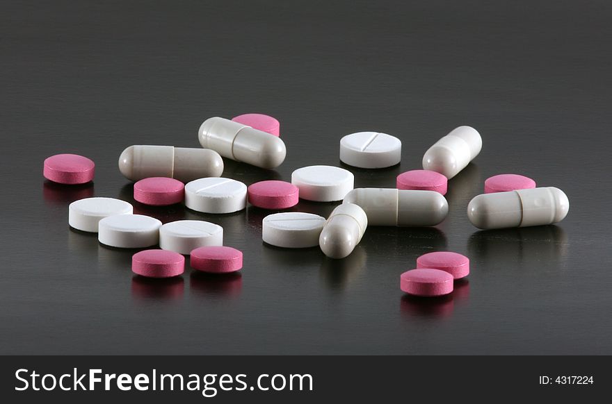 Tablets And Pills On A Black Background