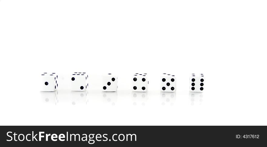 Dice on a white background lined up numerically. Dice on a white background lined up numerically.