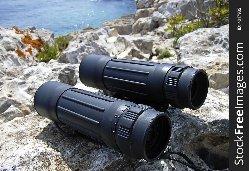 Hand-held binoculars used in exploration for viewing distant objects