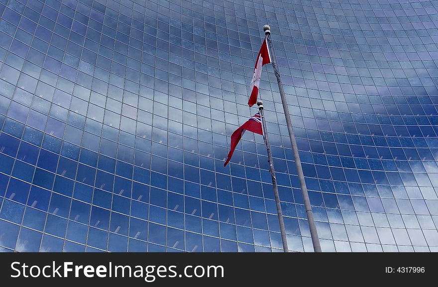 Canadian flag blowing in the wind against windows:. Canadian flag blowing in the wind against windows: