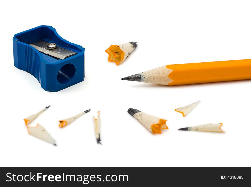 Pencil sharpener and cuttings, isolated on white background
