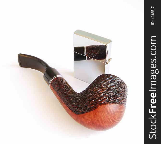 Tobacco-pipe and cigarette-lighter on a white background